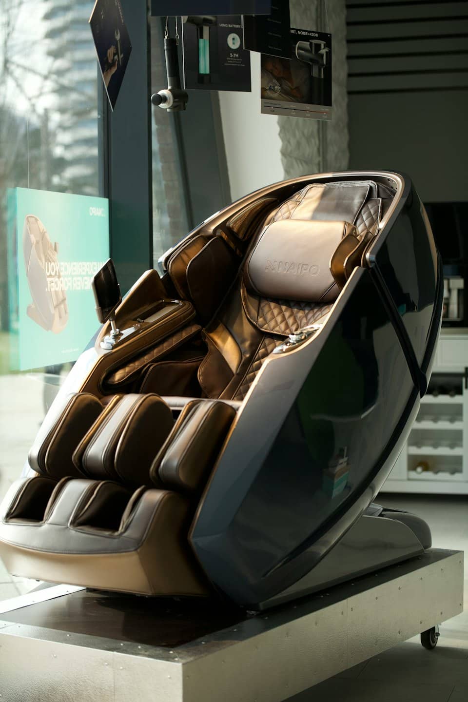 Modern dark brown massage chair in a showroom.